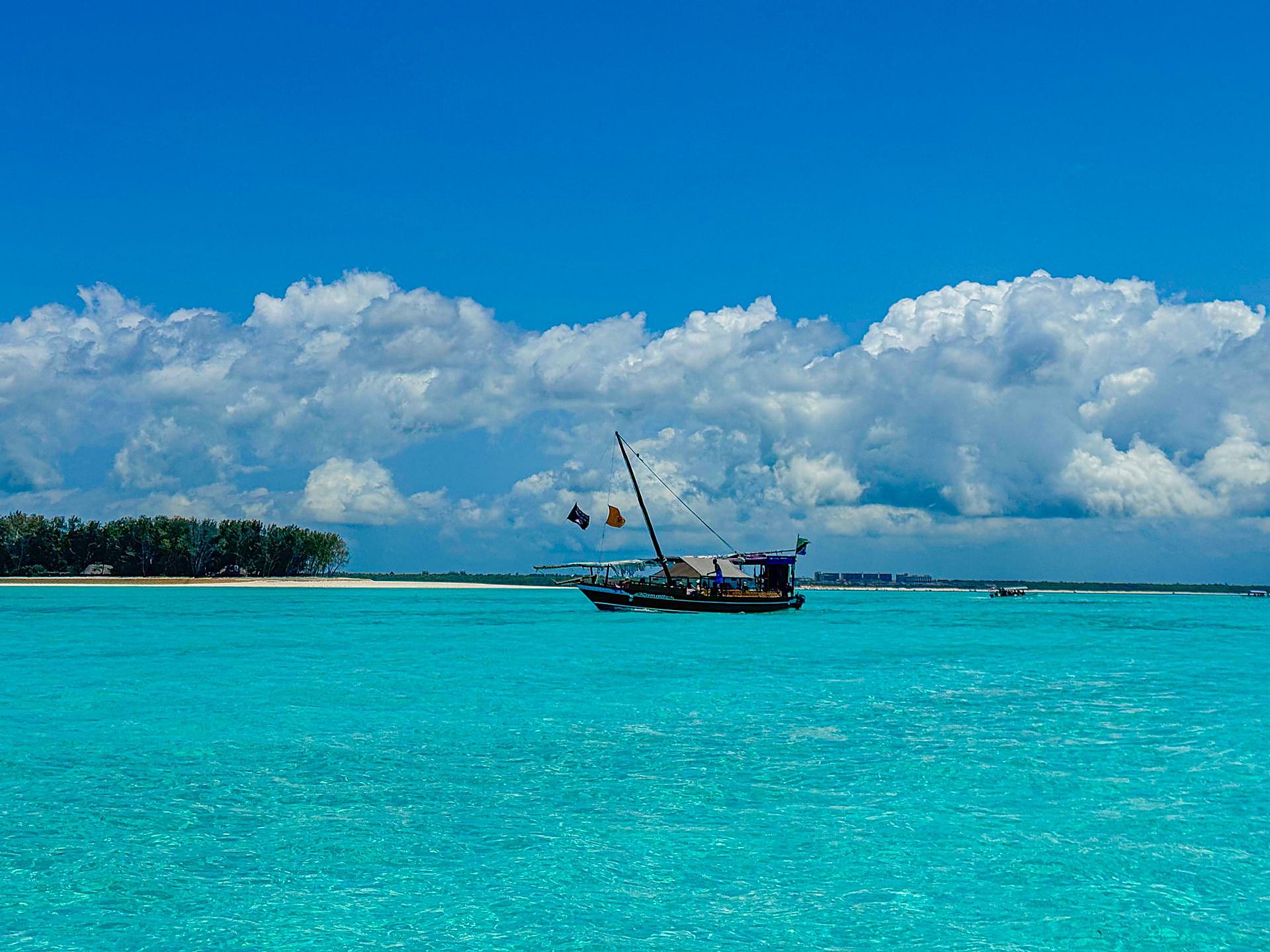 Dhow on turquoise ocean, Zanzibar
